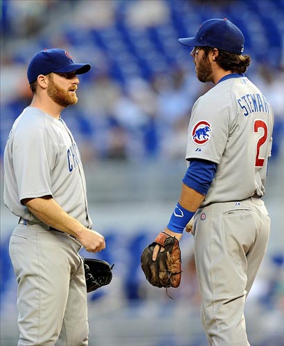 Chicago Cubs starting pitcher Ryan Dempster talks with third baseman Ian Stewart